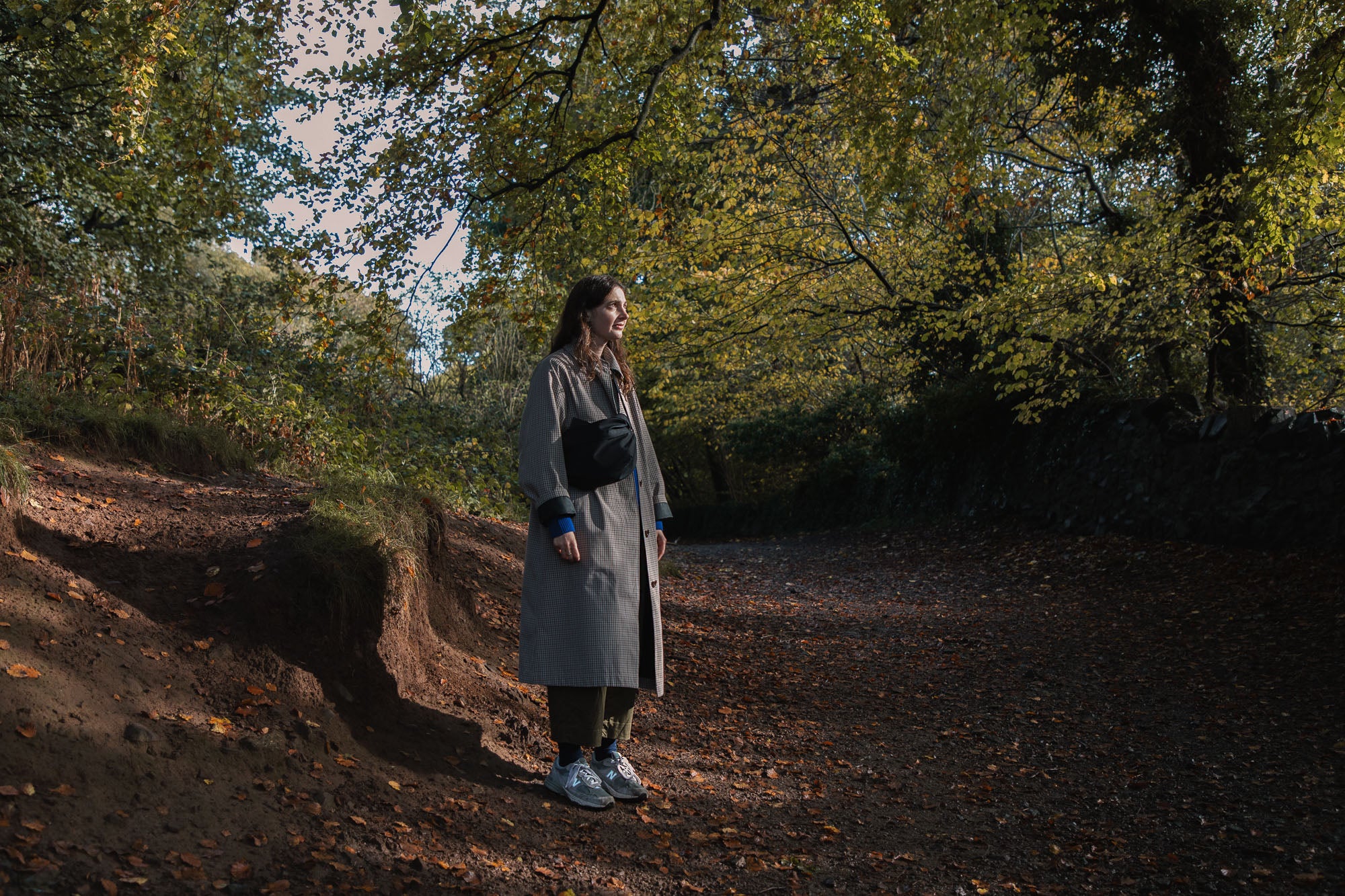 Artist Charlotte Trounce on a woodland path