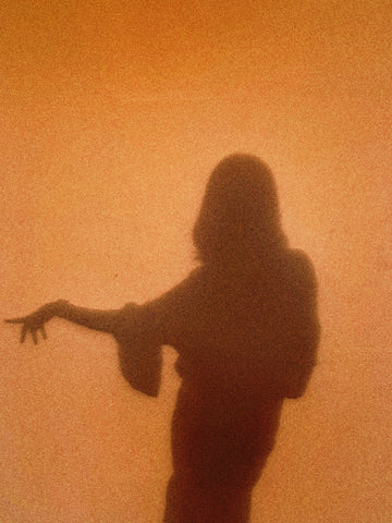 Shadow of a woman dancing