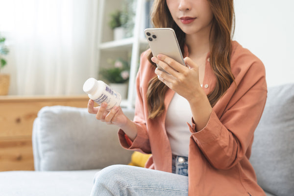 woman looking at ingredients online