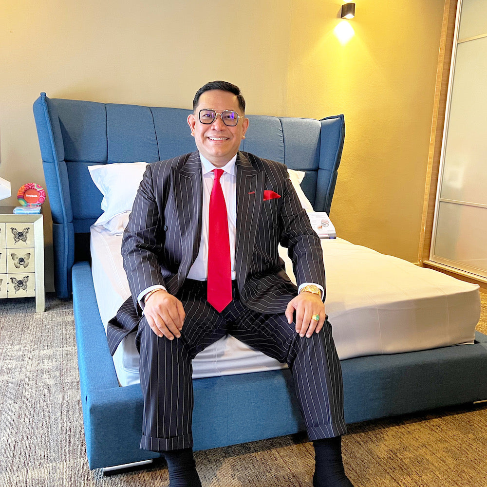 Datuk Seri Dr Erwan Tahir sit on a SweetDream Emporium bed Malaysia