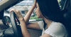 Woman with a headache in the car looking drowsy