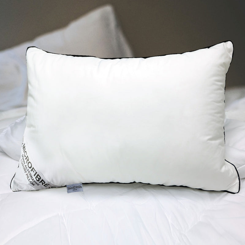 Front view of Hotel Microfiber pillow on a white mattress