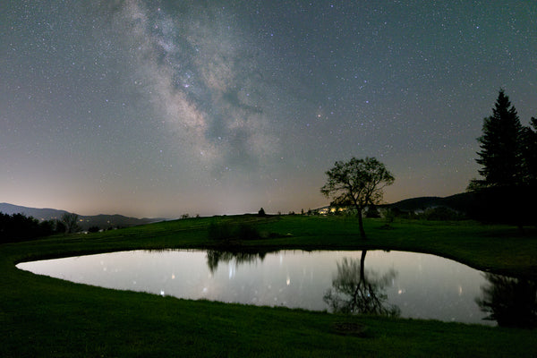 A small pond with the Milky Way core in the backgound