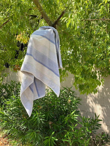 towel hanging off tree branch