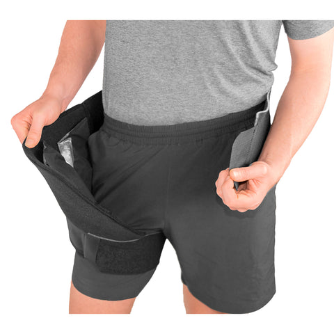 Image of 7550 Universal Hip Compression Wrap where the wrap is attached around the leg and being pulled away from the body to adjust the 2 frozen First Ice® Direct Stick™ packs that are applied to the wrap.