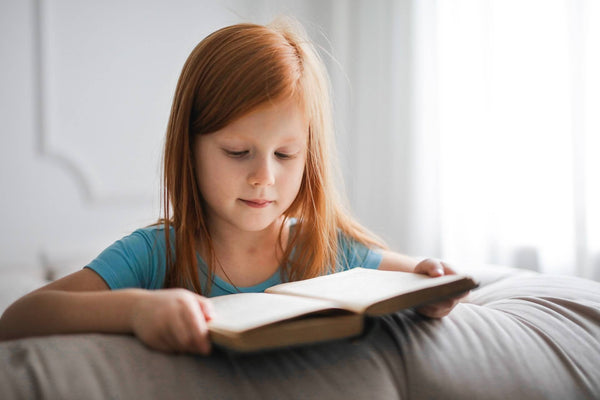 Child reading calmly reduced stimming