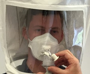 Man undergoing face fit testing for respiratory protection equipment maintenance