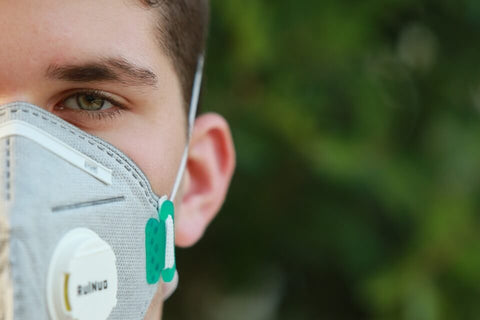 A man wearing a half-mask which has been fit2fit tested to ensure his protection.