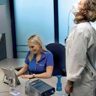 Woman doing respiratory protection equipment maintenance