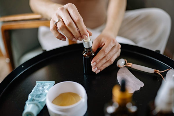 woman prepares her skincare routine with trixsent essential oils made by athena klee in vancouver canada that are organic and crueltyfree