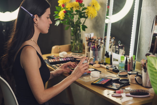 a woman looks at her counter of makeup and wishes she had trixsent organic and crueltyfree beauty by athena klee in canada