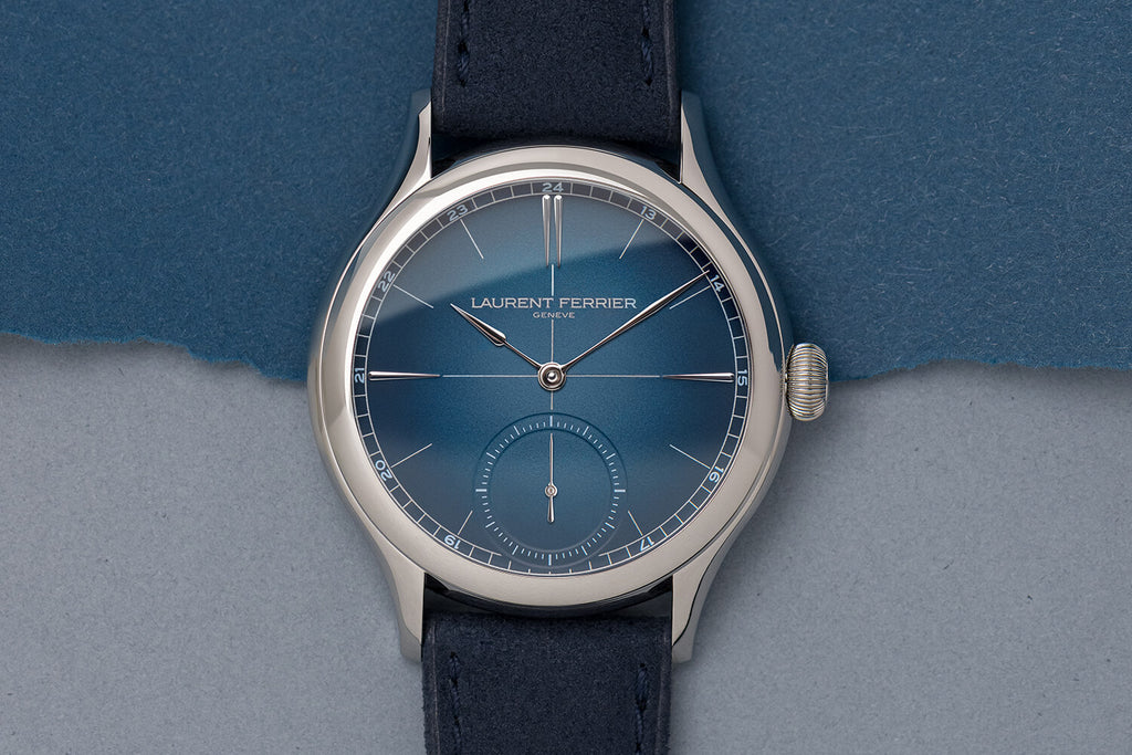 Classic Origin Blue opaline gradient dial watch by Laurent Ferrier shot flat against a two tone navy and light blue paper. Cyril Biselx is the photographer