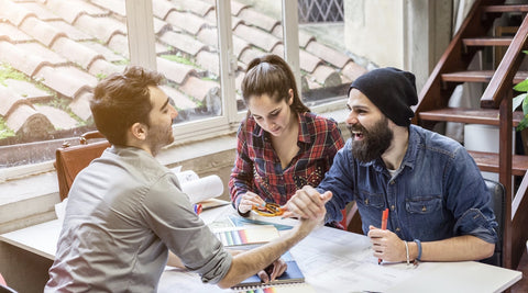 Happy workers at a table