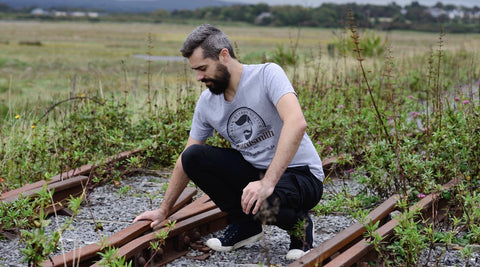 Bearded guy on train tracks