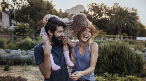 Happy bearded man with his wife and child