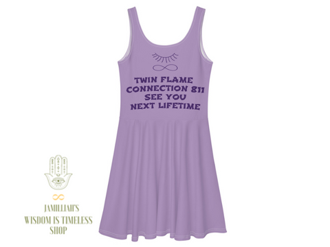 Jamilliahs Wisdom Is Timeless Shop merchandise shown with hamsa hand/infinity symbol logo, at wisdomistimeless.com. Purple skater dress back, with original logo and quote. "Twin Flame Connection 811 See You Next Lifetime."