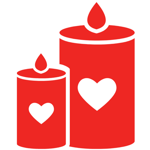 Two twin flame candles. Red candles with white hearts, and white rims. Smaller candle is part of the larger candle.