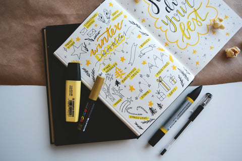 Yellow and black doodles on notepad