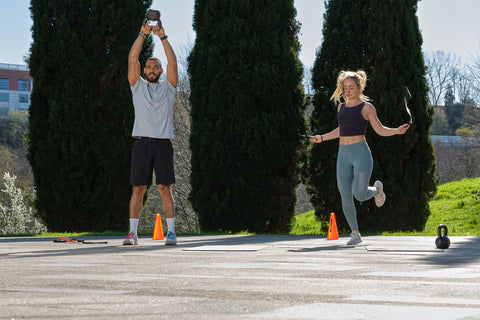 couple doing high intensity interval training outside