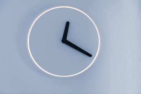 A faceless clock with a blue background