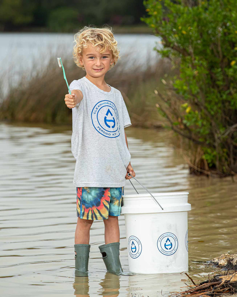 Oliver found an old plastic toothbrush and saved it from floating out to sea.