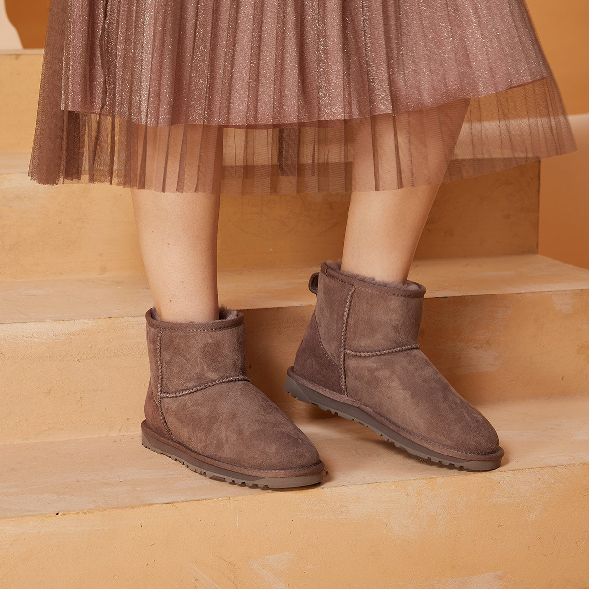 UGG boots paired with matching skirt