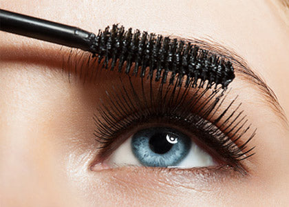 Person applying mascara