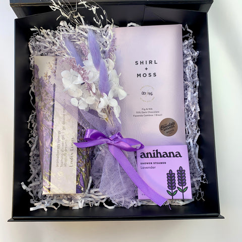 Gift box with purple products, chocolate and body wash