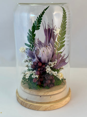 Dried flowers in mini dome by Pink Trunk