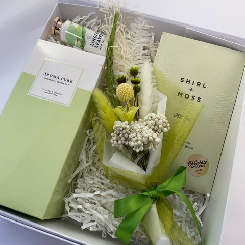 Gift box with green theme, room scent, chocolate and flowers