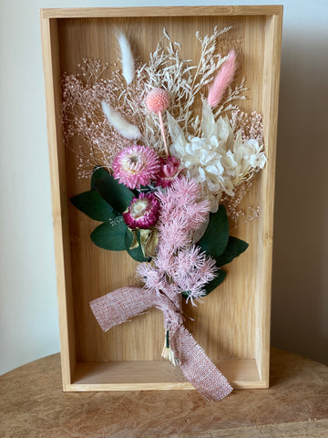 Wooden box with dried flowers