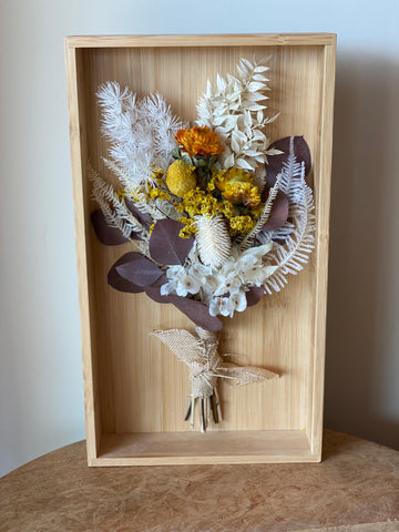 Wooden box containing dried flowers
