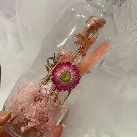Dried flowers in a glass bottle