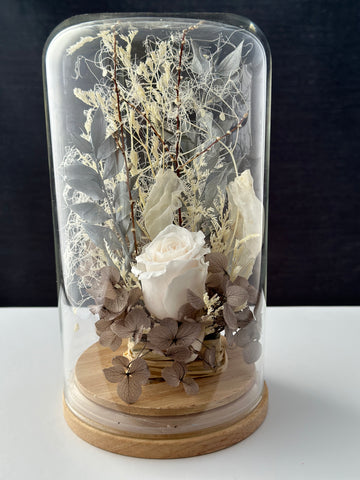 white dried flowers in a dome