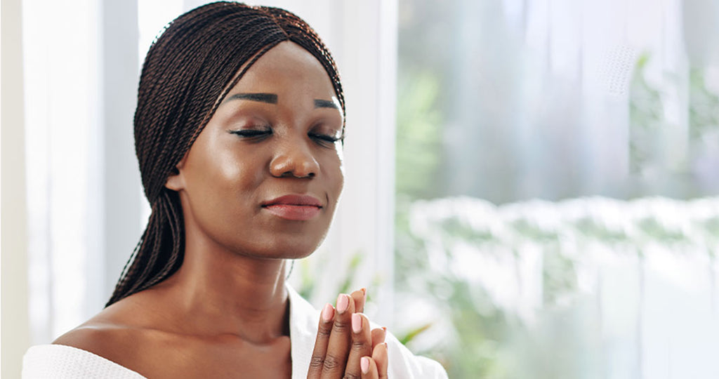 woman eyes closed while she pray