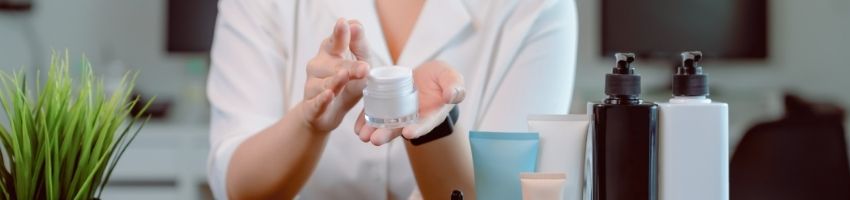 Woman with Bottles of Skincare