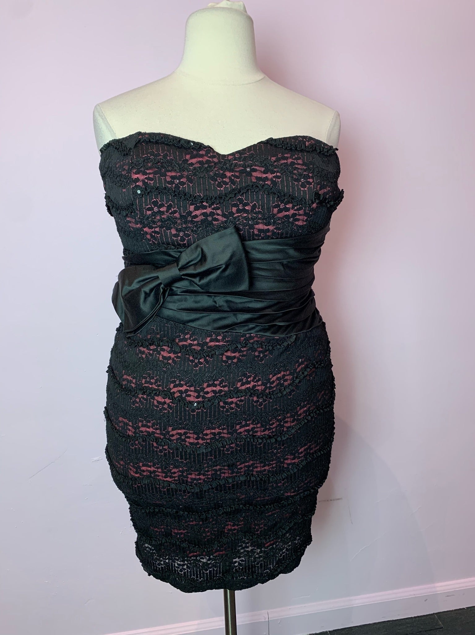 pink dress with black lace overlay