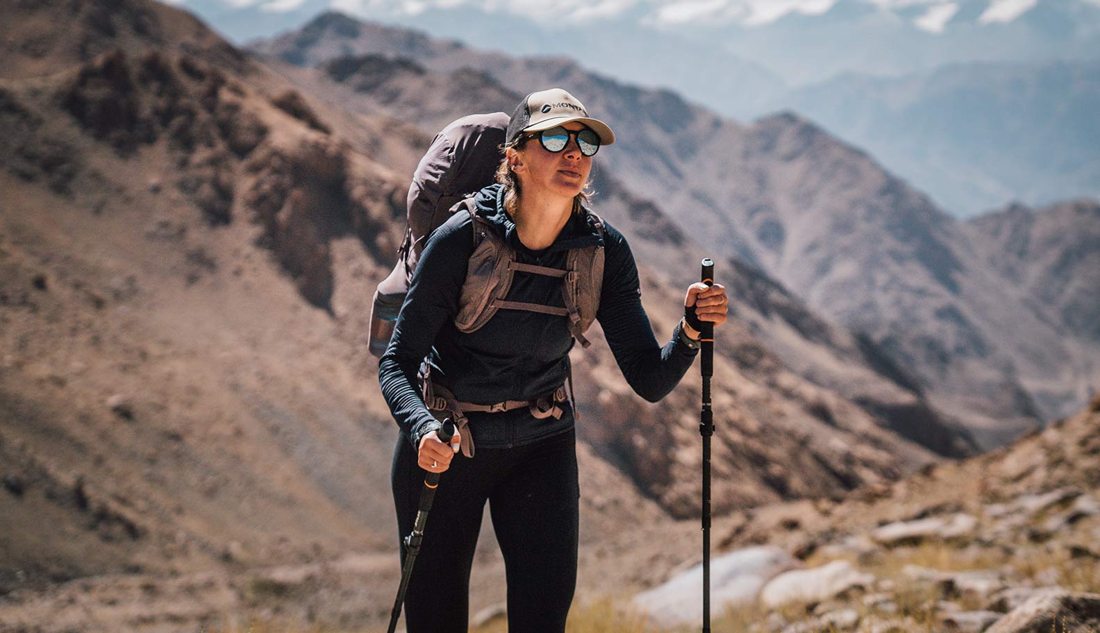 woman-trekking-up-montain-in-nepal