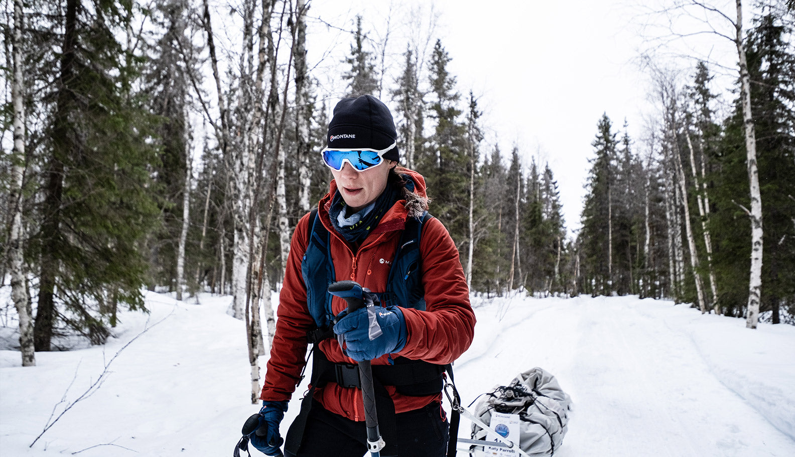 woman-running-winter-pulling-sled