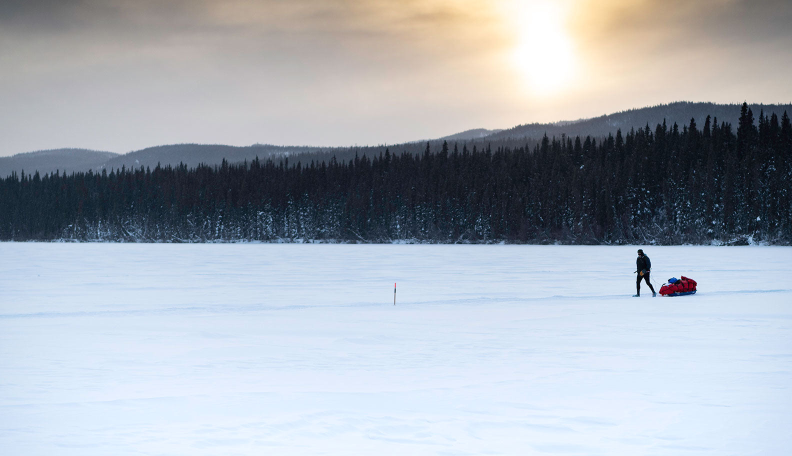 Athlete pulling sled in the remote Yukon wilderness | Montane Yukon Arctic Ultra