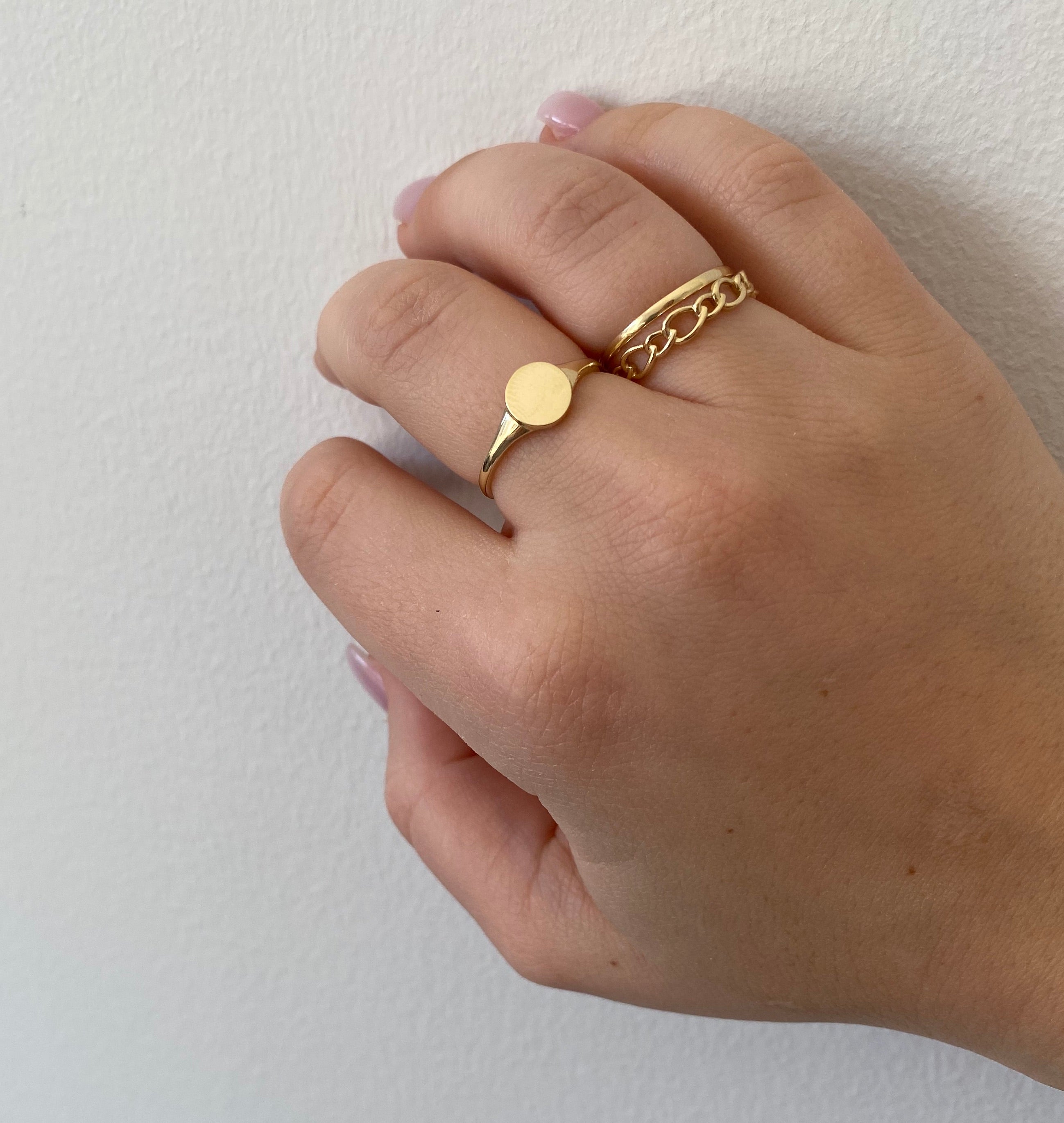 hand with gold rings