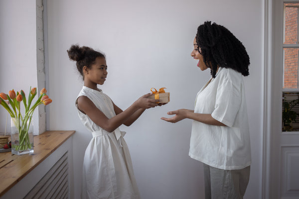 daughter giving mom gift