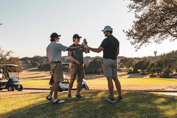 3 men golfing