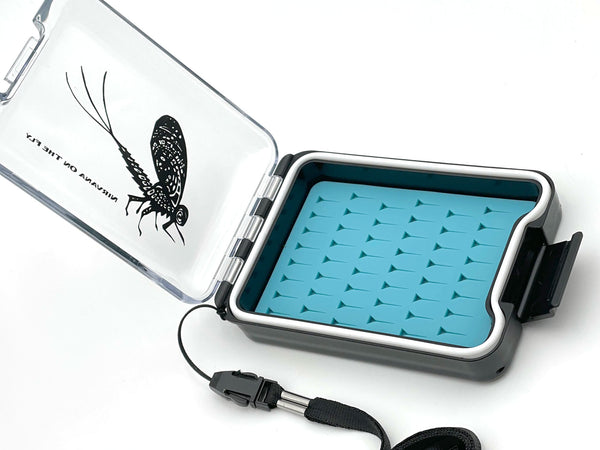 Image of the NIRVANA On The Fly Small Silicone Waterproof Fly Box w/ Artwork by Anthony Naples in the Aqua Blue Color