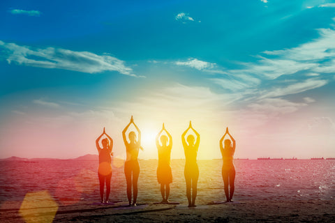 Young group man and woman yoga practice on mat relaxation