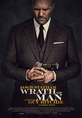 Wrath of Man movie poster showing the Protaganist, played by Jason Statham, standing in a suit, downcast, clutching his bloodied hands together.