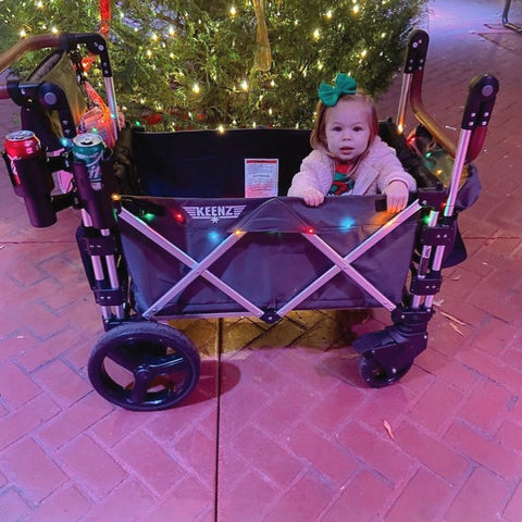 watching a holiday parade in a stroller wagon