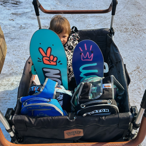 snowboard gear in a stroller wagon