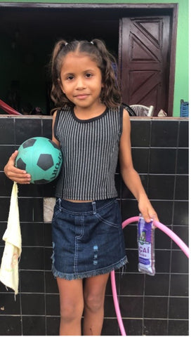 young girl with acai pack