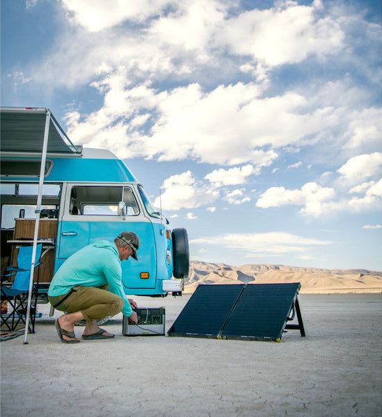 Goal Zero Yeti Portable Power Station and solar panels with a Volkswagen Kombi in the background